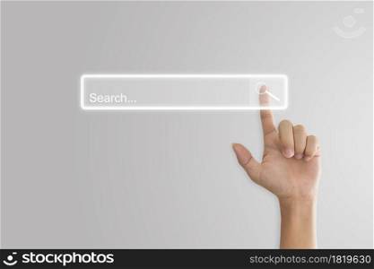 Hand click search button page on virtual screen. Idea for searching browse data information networking. Copy space for text.