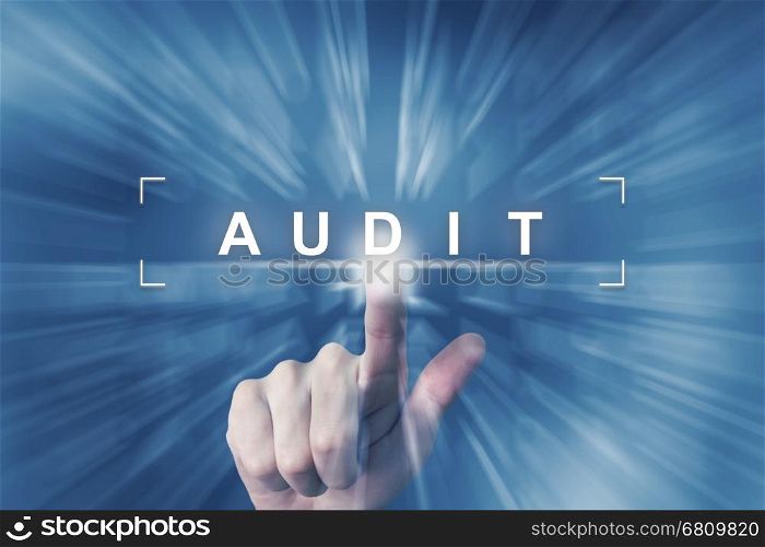 hand clicking on audit button with zoom effect background