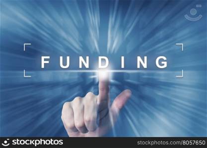 hand clicking on financial funding button with zoom effect background