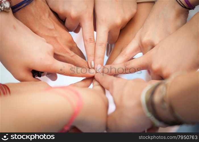 Hand coordination Used together, the harmonization of teamwork in the workplace.