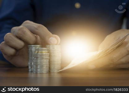 Hand counting money and coins stack business investment