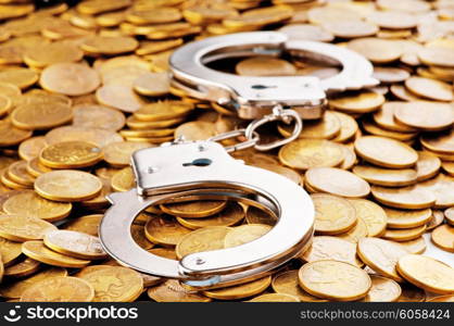 Hand cuffs and coins as security concept