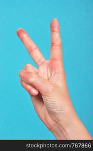 Hand doing peace signs