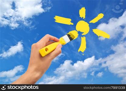 Hand draw the sun in sky. Conceptual design.