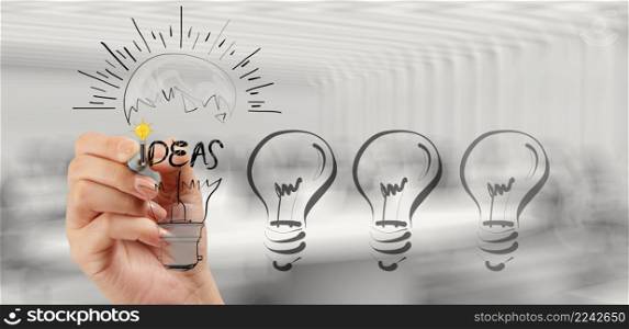 hand drawing creative business strategy with light bulb as concept