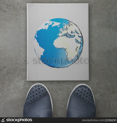 hand drawn  abstract globe on front of business man feet as concept