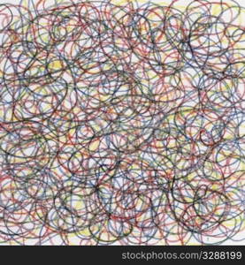 hand-drawn crayon circular scribble on white paper, red, blue, black and yellow lines