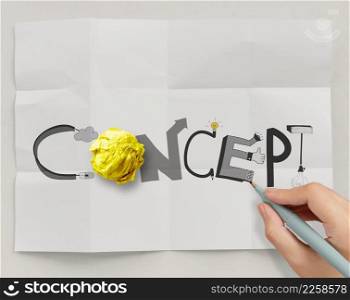 hand drawn design word CONCEPT with crumpled paper ball on paper background as creative concept