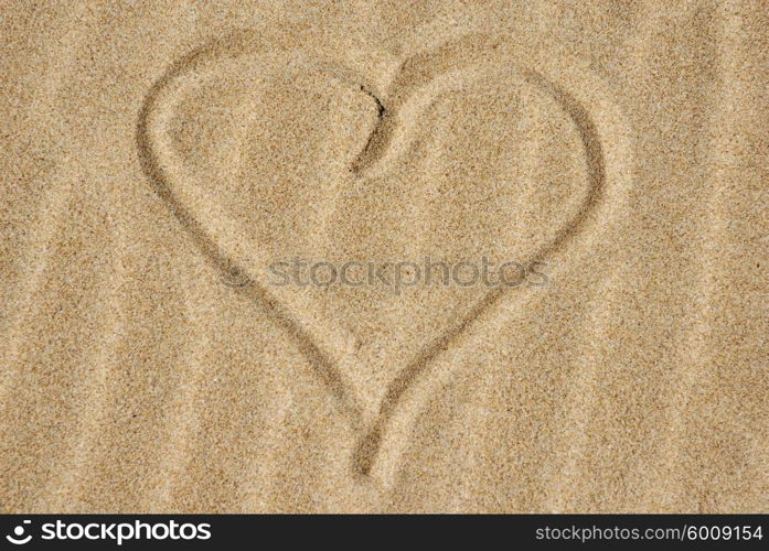 Hand drawn heart on the sand detail