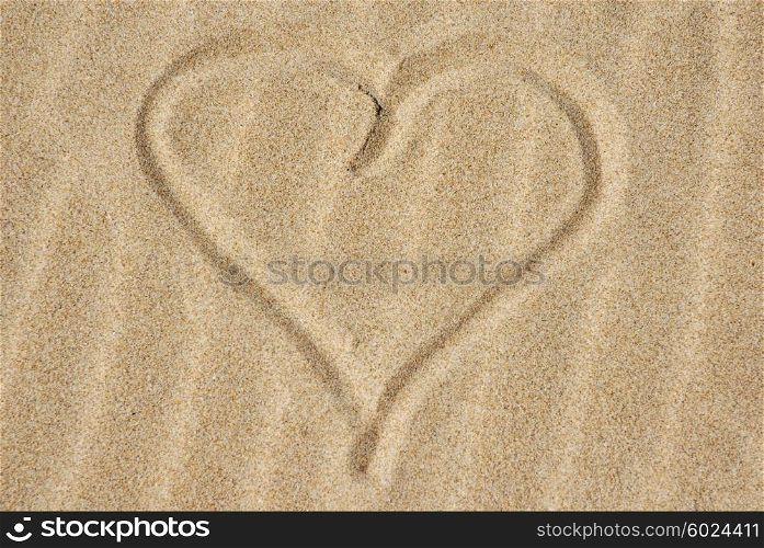 Hand drawn heart on the sand detail