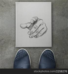 hand drawn Human Hand Sign on canvas board background front of business man feet as concept