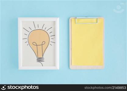 hand drawn light bulb frame clipboard with yellow paper