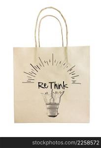 Hand drawn light bulb with RETHINK word paper recycle bag on white background as concept