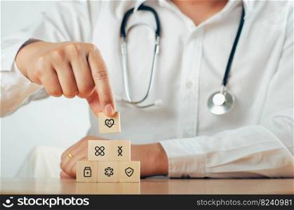 Hand drawn wooden block arrangement with healthcare medical icons - health concept
