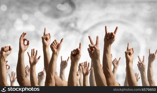 Hand gestures in arow. Group of people with hands up showing gestures