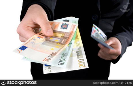 Hand giving Euro banknotes of 50, 100 and 200 Euro with another hand in the background keeping the spare. Isolated. Studio shot.