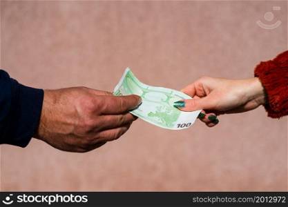 Hand giving money like bribe or tips or salary isolated, hard worked hand taking euro banknotes. Currency transfer and reward for hard work.. Hand giving money like bribe or tips or salary isolated, hard worked hand taking euro banknotes. Currency transfer and reward for hard work.