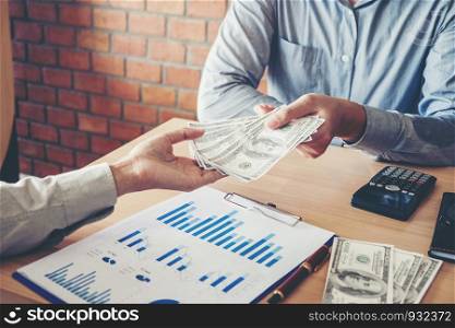 Hand giving money United States Dollars bills ,Hand receiving money from businessman