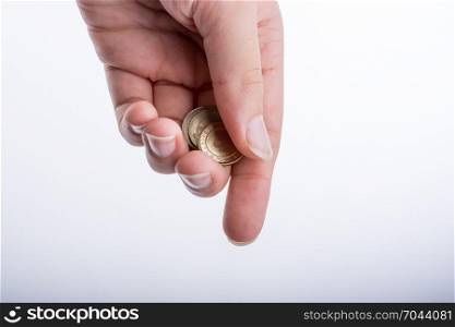 Hand handing money on a white bakground