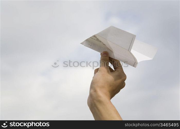 Hand having the paper plane