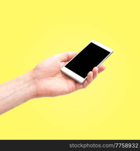 Hand holdi smartphone  empty screen isolated on yellow background