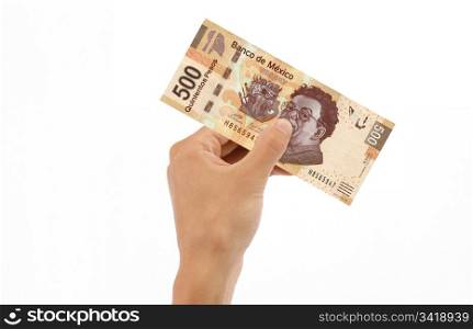 Hand holding 500 Mexican Pesos Bill islolated on white background.