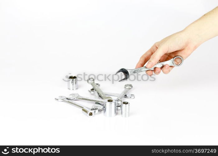 Hand holding a bunch of working tools