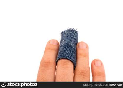 Hand holding a denim fabric piece on white background