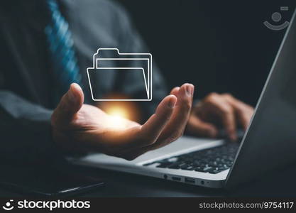 Hand holding a folder icon on a virtual screen, representing a Document Management System  DMS  concept. Efficiently manage and archive information with ERP. Corporate technology in practice.. Virtual screen displaying folder icon and automation software