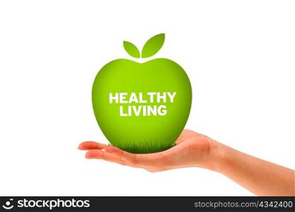 Hand holding a green healthy living apple.