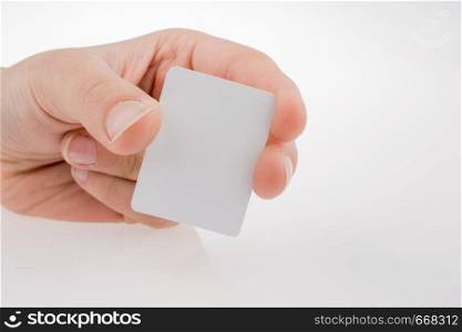 Hand holding a piece of paper on a white background