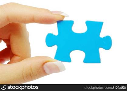 hand holding a puzzle piece