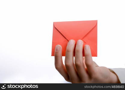 hand holding a red envelope on a white background