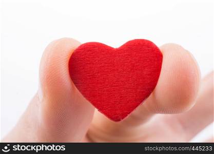 Hand holding a red heart