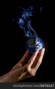 Hand holding a smoky earth