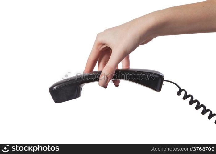 Hand holding an old black telephone tube isolated on white background