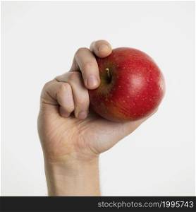hand holding apple