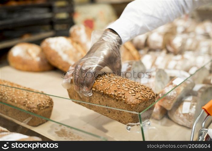hand holding bread blurred background