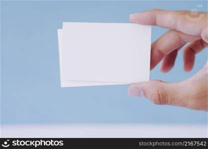 hand holding business cards