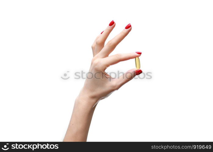 Hand holding capsule of Omega 3 on white background. Close up. High resolution product.. Hand holding capsule of Omega 3 on white background. Close up. High resolution product. Health care concept