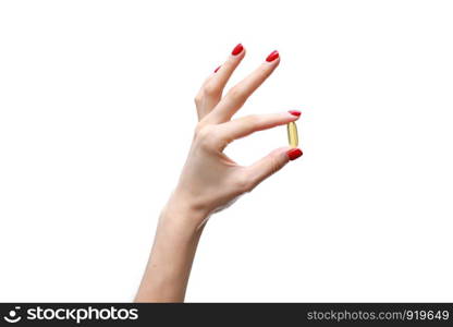 Hand holding capsule of Omega 3 on white background. Close up. High resolution product.. Hand holding capsule of Omega 3 on white background. Close up. High resolution product. Health care concept