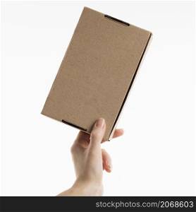 hand holding cardboard box