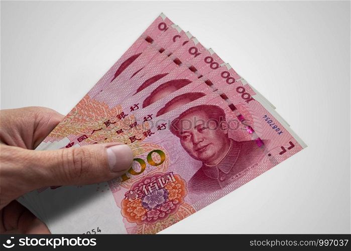 Hand holding Chinese Renminbi. RMB. Currency of China.. Hand holding Chinese Renminbi. RMB. Money of China.