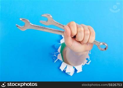 Hand holding chrome wrenh