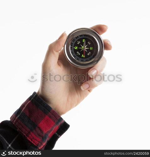 hand holding compass