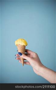 hand holding delicious ice cream cone