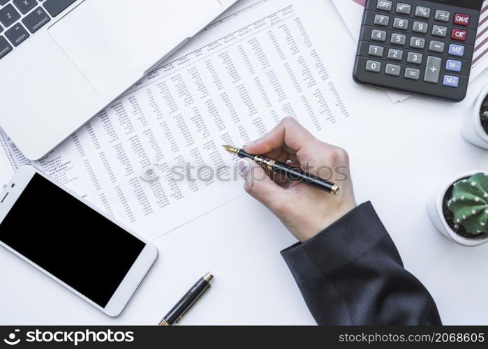 hand holding fountain pen office desk