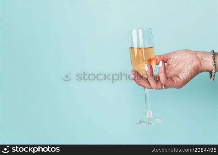 hand holding glass with copy space