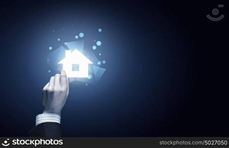 Hand holding house. Vector Illustration.. Close up of hand holding digital icon