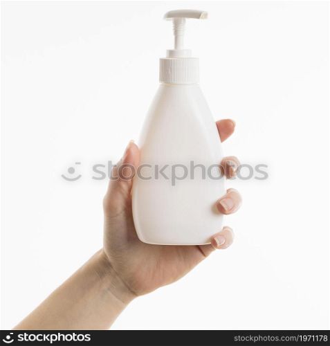 hand holding liquid soap bottle. High resolution photo. hand holding liquid soap bottle. High quality photo